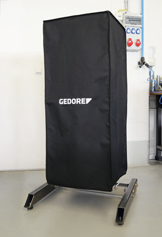 Protective cover for stationary spring compressor